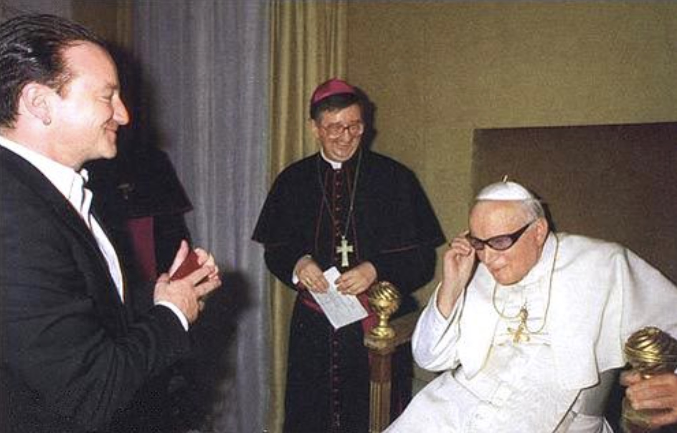 Pope John Paul II wearing Bono’s glasses 